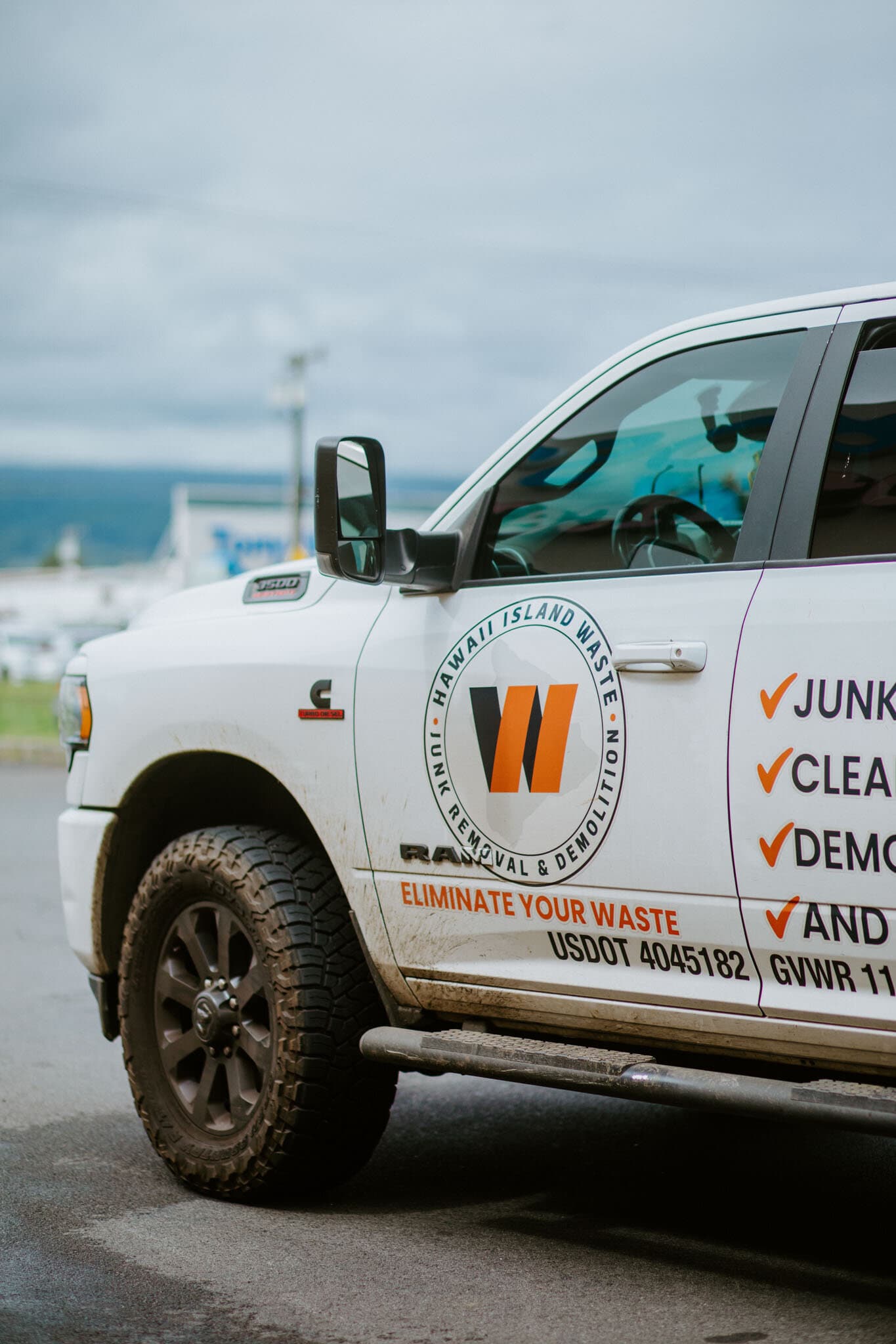 Close-up of the Hawaii Island Waste branded Ram 2500 truck — junk removal & demolition